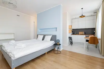 Łóżko lub łóżka w pokoju w obiekcie RentPlanet - Studio Białobrzeska
