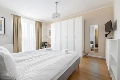 Łóżko lub łóżka w pokoju w obiekcie RentPlanet - Studio Białobrzeska
