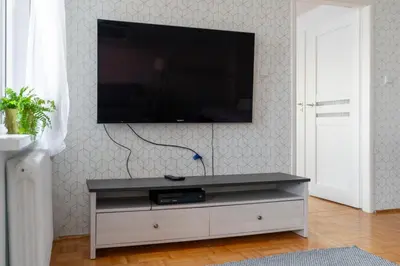 Telewizja i/lub zestaw kina domowego w obiekcie Mokotów Serene Apartment by BookingHost