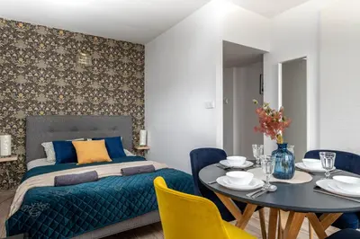 Łóżko lub łóżka w pokoju w obiekcie Al Solidarności apt 42 SuperApart - Studio with Balcony