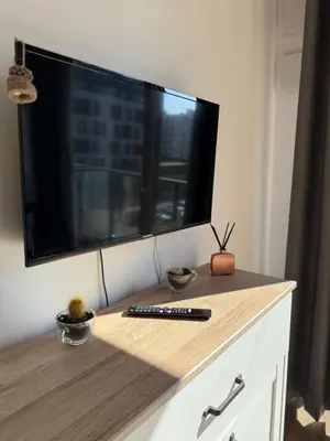 Telewizja i/lub zestaw kina domowego w obiekcie A63 by Real Apartment