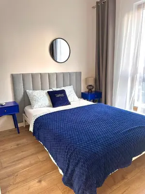 Łóżko lub łóżka w pokoju w obiekcie A63 by Real Apartment