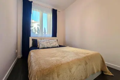 Łóżko lub łóżka w pokoju w obiekcie Apartament Kamienica