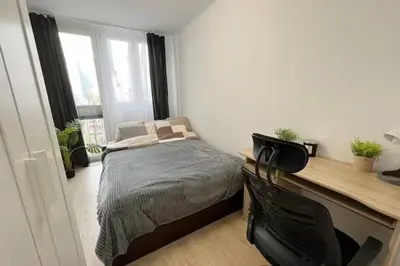Łóżko lub łóżka w pokoju w obiekcie Rentel Hostel