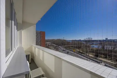Balkon lub taras w obiekcie Bright CityView Apartment with AC near PGE Narodowy by Noclegi Renters