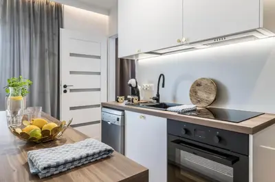 Kuchnia lub aneks kuchenny w obiekcie Nowolipie Blue Apartament
