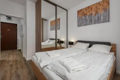 Łóżko lub łóżka w pokoju w obiekcie Rakowska 14A by Homeprime