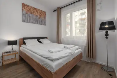 Łóżko lub łóżka w pokoju w obiekcie Rakowska 14A by Homeprime