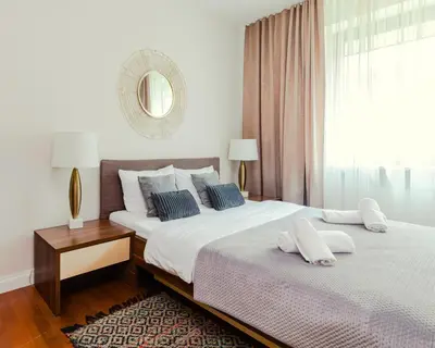 Łóżko lub łóżka w pokoju w obiekcie Apartament Atelier Residence