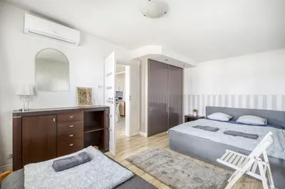 Łóżko lub łóżka w pokoju w obiekcie Apartament Centrum