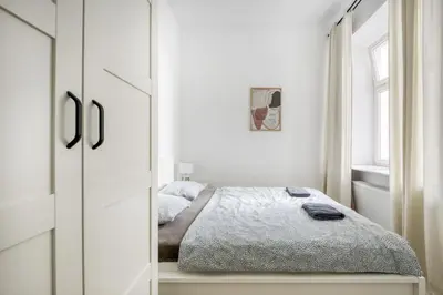 Łóżko lub łóżka w pokoju w obiekcie Apartament Centrum