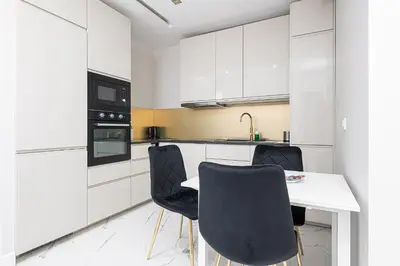 Kuchnia lub aneks kuchenny w obiekcie RentPlanet - Apartament Rodziewiczówny