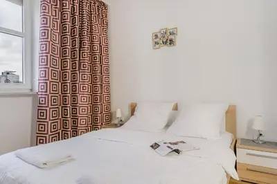 Łóżko lub łóżka w pokoju w obiekcie P&O Apartments Marszałkowska I