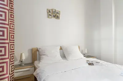 Łóżko lub łóżka w pokoju w obiekcie P&O Apartments Marszałkowska I