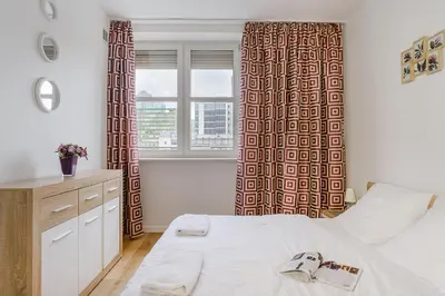 Łóżko lub łóżka w pokoju w obiekcie P&O Apartments Marszałkowska I