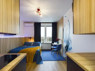 Łóżko lub łóżka w pokoju w obiekcie Modern Air-conditioned Studio by Noclegi Renters