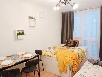 Łóżko lub łóżka w pokoju w obiekcie 1010 Warsaw Centrum