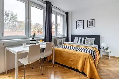 Łóżko lub łóżka w pokoju w obiekcie Jana Kilińskiego Apt 6 SuperApart - w sercu Starego Miasta