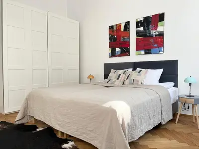 Łóżko lub łóżka w pokoju w obiekcie Lwowska 6 Warszawa Centrum