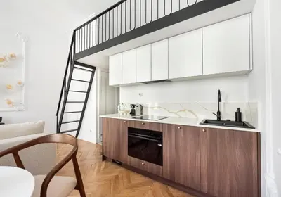 Kuchnia lub aneks kuchenny w obiekcie Wilcza Apartment with Mezzanine by BookingHost