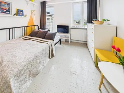Łóżko lub łóżka w pokoju w obiekcie Intimate Studio Close to PGE Narodowy by Noclegi Renters