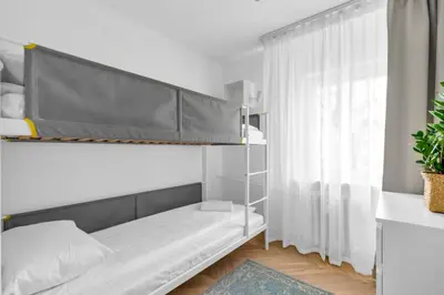 Łóżko lub łóżka w pokoju w obiekcie Warszawa Rakowiec Stylish Apartment by BookingHost