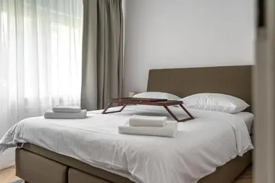 Łóżko lub łóżka w pokoju w obiekcie Warszawa Rakowiec Stylish Apartment by BookingHost
