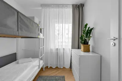 Łóżko lub łóżka w pokoju w obiekcie Warszawa Rakowiec Stylish Apartment by BookingHost