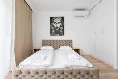 Łóżko lub łóżka w pokoju w obiekcie RentPlanet - Apartamenty Krochmalna