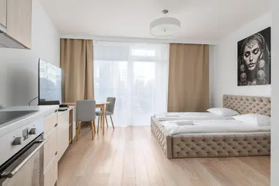 Łóżko lub łóżka w pokoju w obiekcie RentPlanet - Apartamenty Krochmalna