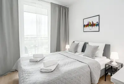 Łóżko lub łóżka w pokoju w obiekcie Warsaw Capital Comfort Apartments