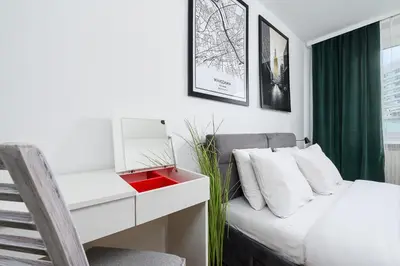 Łóżko lub łóżka w pokoju w obiekcie Lumina 2-room apart near Złote Tarasy