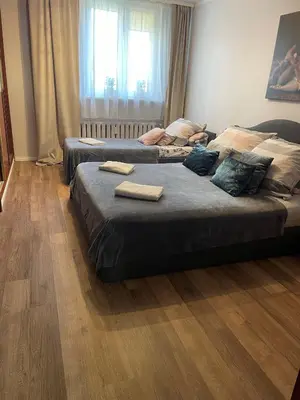 Łóżko lub łóżka w pokoju w obiekcie Apartament Dymińska
