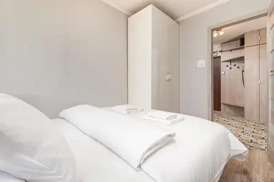 Łóżko lub łóżka w pokoju w obiekcie Apartament Grzybowska by Your Freedom