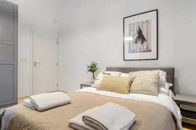 Łóżko lub łóżka w pokoju w obiekcie Warecka I Serviced Apartments