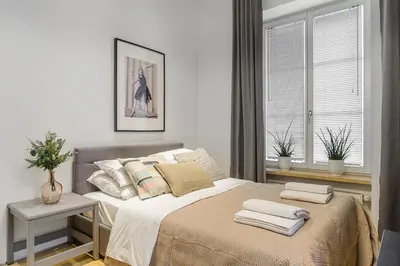 Łóżko lub łóżka w pokoju w obiekcie Warecka I Serviced Apartments