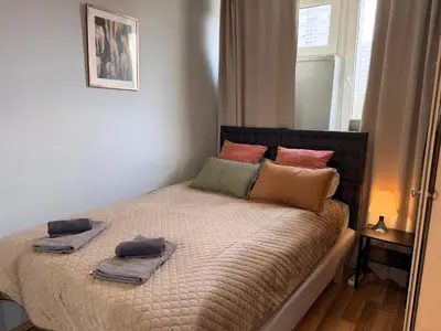 Łóżko lub łóżka w pokoju w obiekcie OhMyHome-Grzybowska
