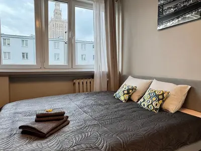 Łóżko lub łóżka w pokoju w obiekcie Warsaw City CENTER Apartment