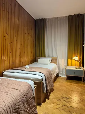 Łóżko lub łóżka w pokoju w obiekcie Pokoje w samym centrum-Walicow 20