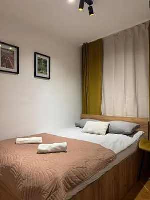 Łóżko lub łóżka w pokoju w obiekcie Pokoje w samym centrum-Walicow 20