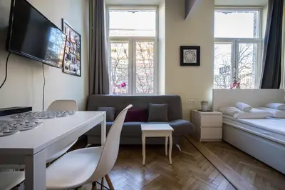 Łóżko lub łóżka w pokoju w obiekcie Elegant Apartment Copernicus