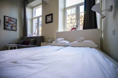 Łóżko lub łóżka w pokoju w obiekcie Elegant Apartment Copernicus