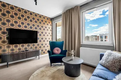 Telewizja i/lub zestaw kina domowego w obiekcie National Stadium Riverside Apartment by BookingHost