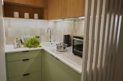 Kuchnia lub aneks kuchenny w obiekcie The Green Nest Apartment Wola Rondo Daszynskiego
