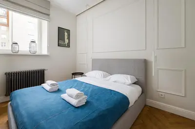 Łóżko lub łóżka w pokoju w obiekcie Praga Residence Apartment by BookingHost
