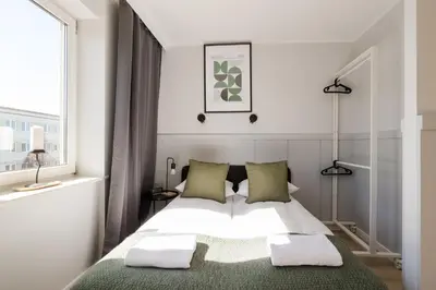Łóżko lub łóżka w pokoju w obiekcie ShortStayPoland Apartamentowa B180