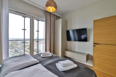 Łóżko lub łóżka w pokoju w obiekcie Kasprzaka 29 Panorama Tower 20 piętro 85m2 By Perfect Apart 2015