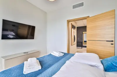 Łóżko lub łóżka w pokoju w obiekcie Kasprzaka 29 Panorama Tower 20 piętro 85m2 By Perfect Apart 2015