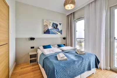 Łóżko lub łóżka w pokoju w obiekcie Kasprzaka 29 Panorama Tower 20 piętro 85m2 By Perfect Apart 2015