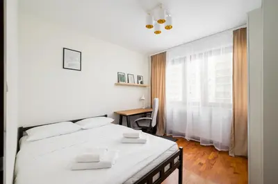 Łóżko lub łóżka w pokoju w obiekcie Metro Wilanowska Cosy Apartment by BookingHost